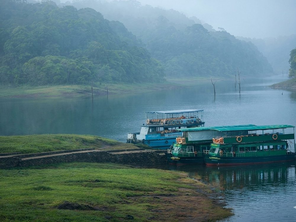 Boats on the misty lake at Thekkady